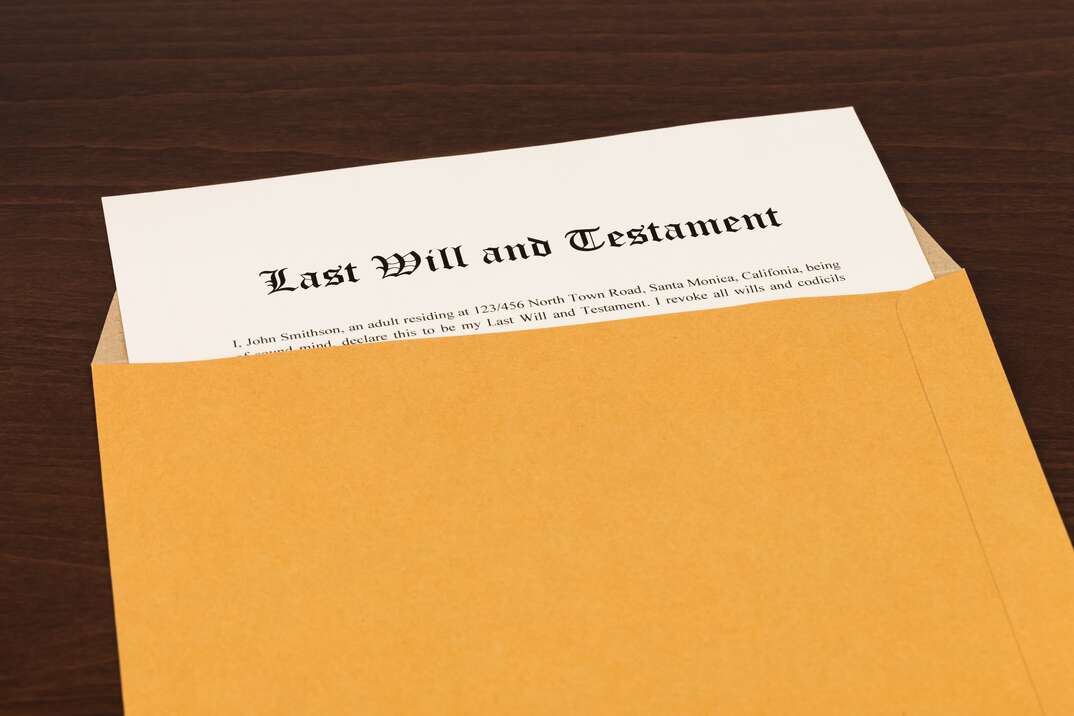 Last will on cream color paper in opened  envelope
