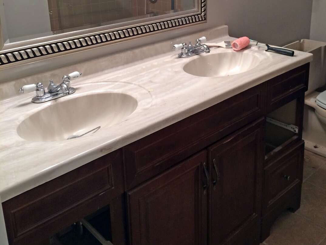 photos show before and after transformation of a bathroom double sink vanity