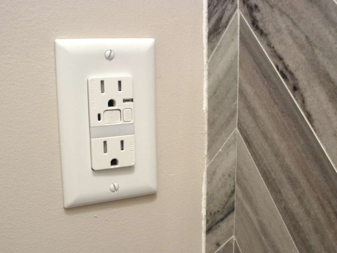 Electricall wall outlet in bathroom