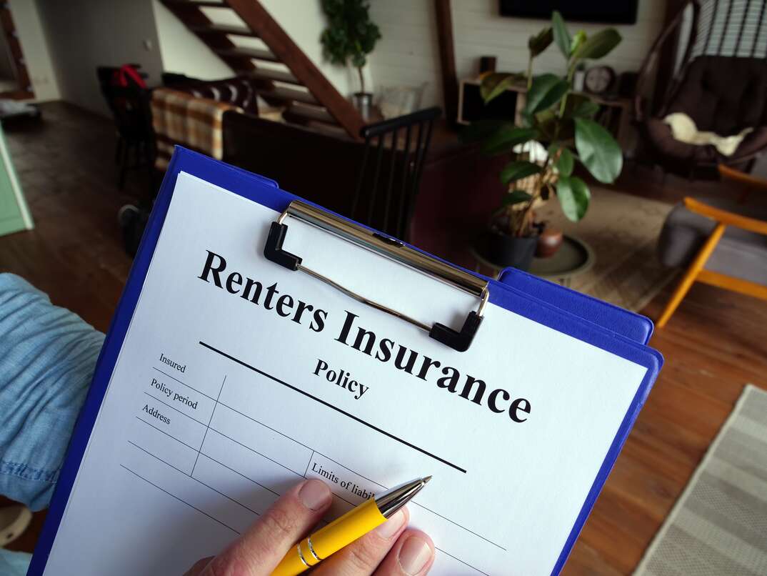 The agent fills out the renters insurance policy.