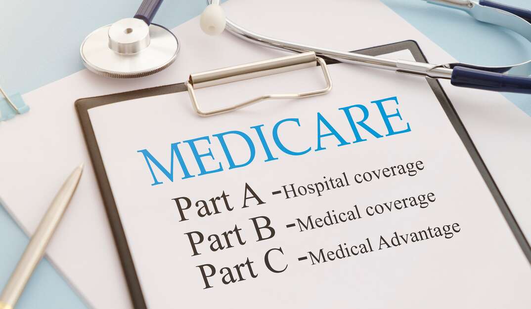 Medical forms sit on a desktop, Medicare, Medicaid, forms, documents, papers, clipboard, notebook, calculator, pen, ink pen, desk, desktop, stethoscope, medical, medical coverage, medical insurance, health, health insurance, health coverage