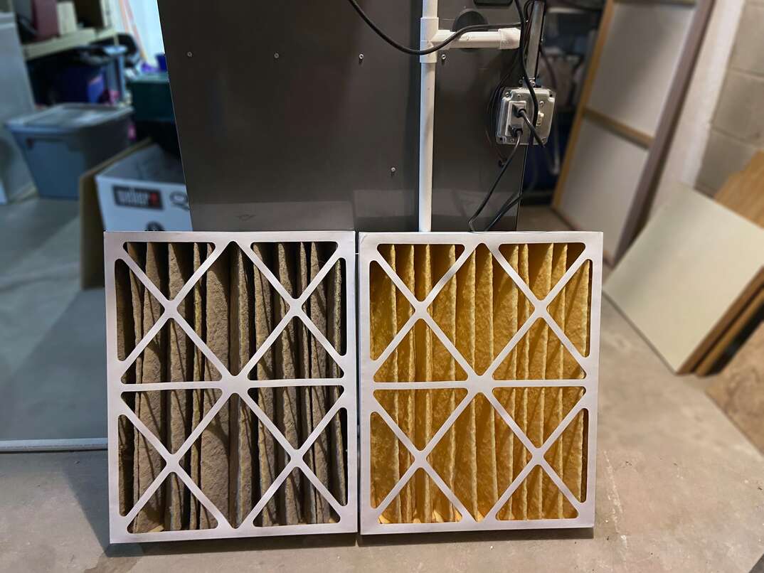 A side by side comparison of a clean HVAC furnace filter and a dirty filter 