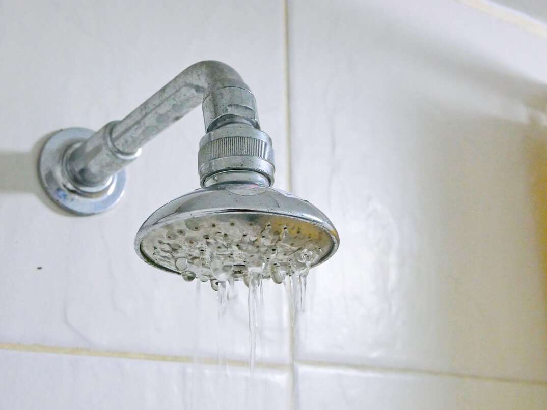 water showerhead in bathroom