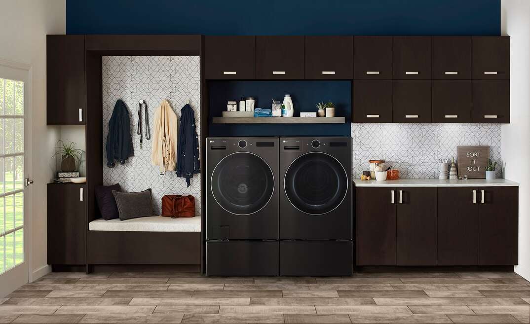 dark laundry room with lg washer and dryer