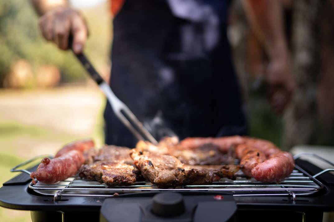 Barbecue being prepared by a man