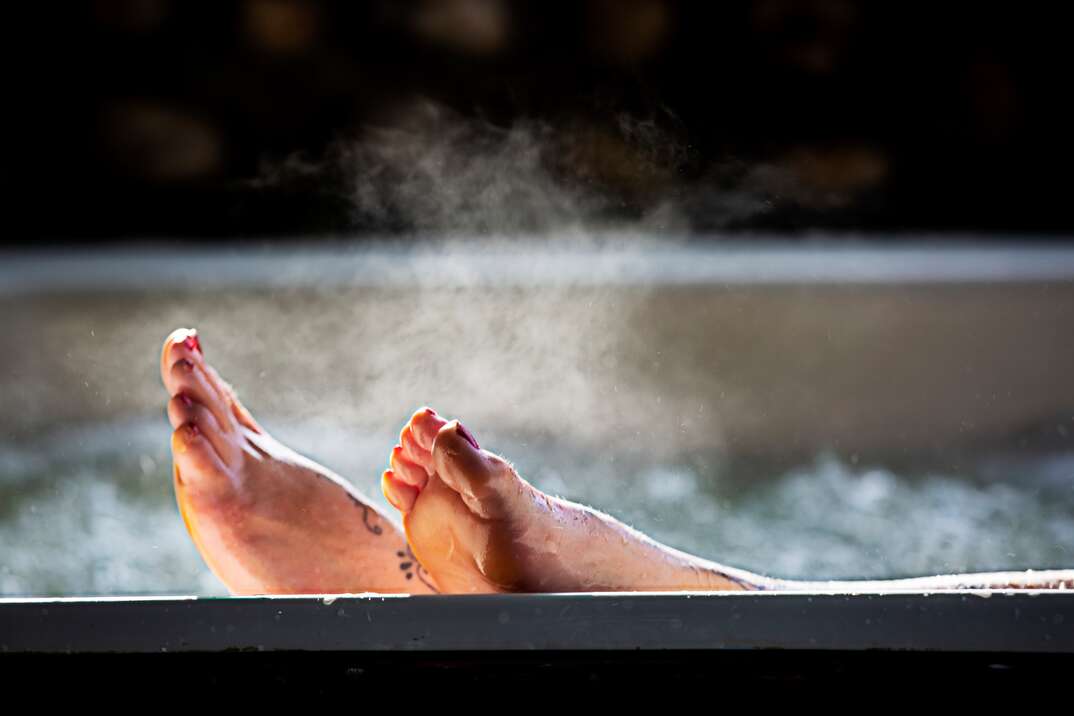 Woman with her feet up while in a hot tub