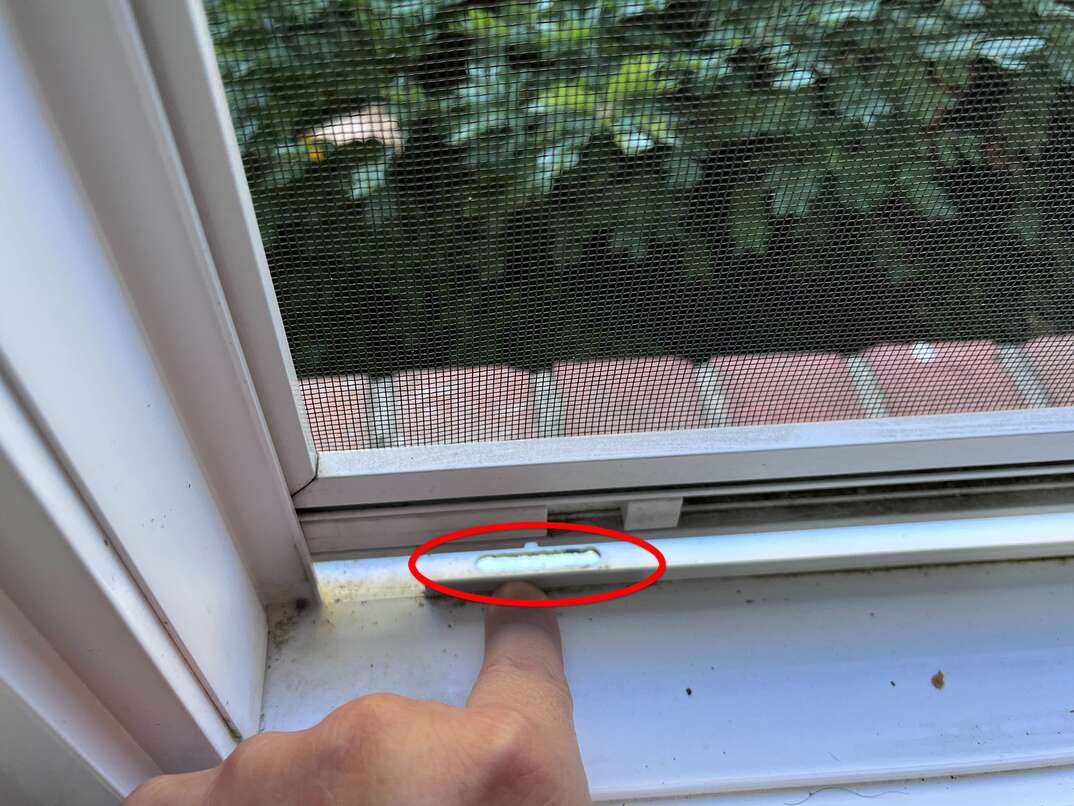 Different cleaning supplies and tools on window sill indoors Stock