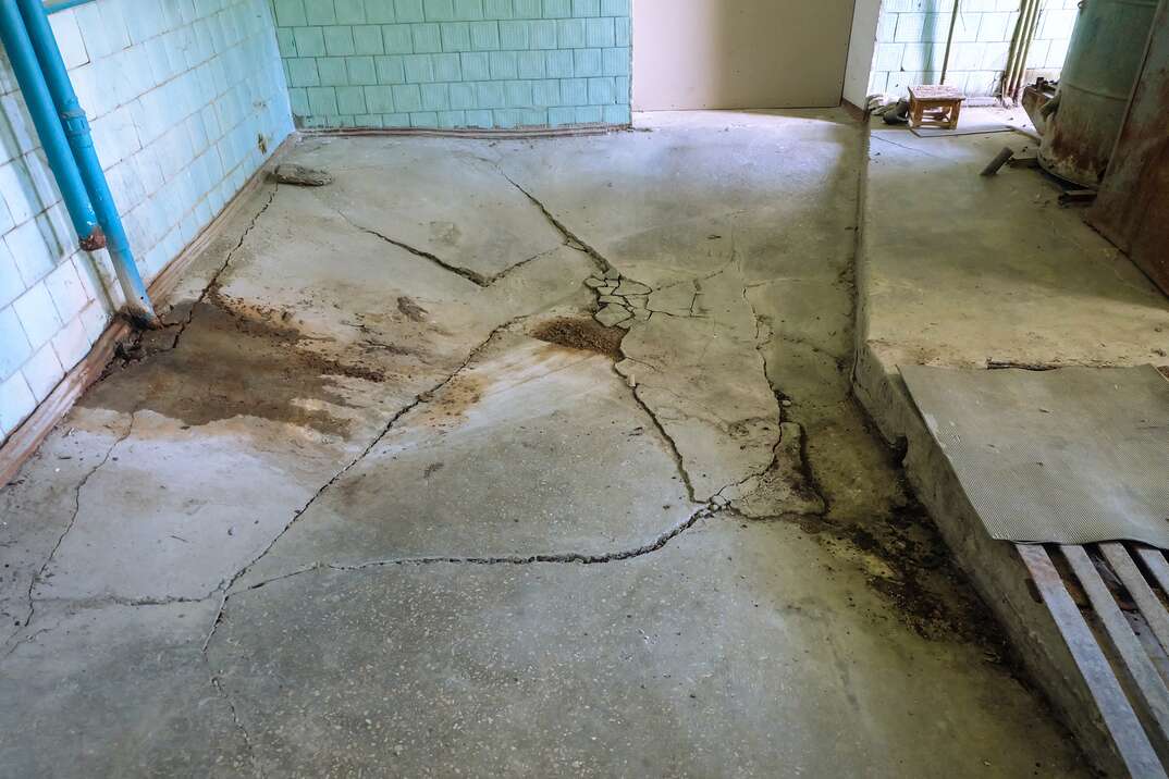 Destroyed concrete flooring due to subsidence of the base soil