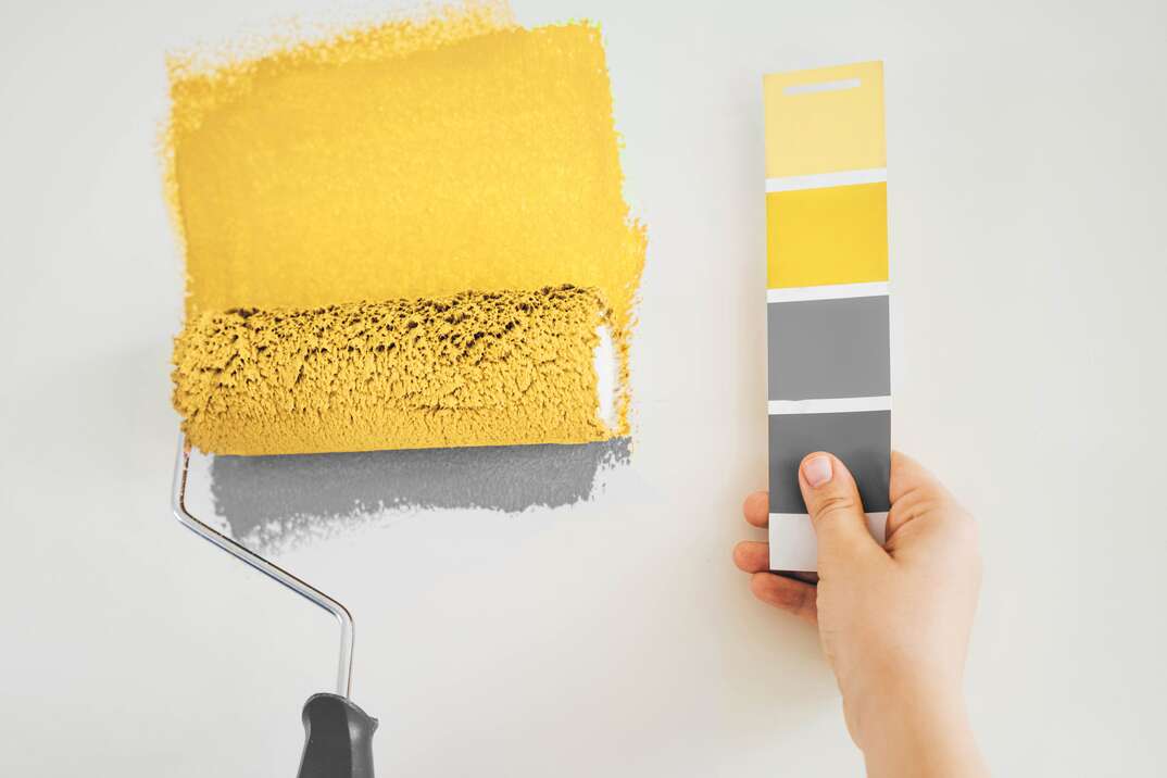 Close up paint brush and color charts. Concept of color of the year.