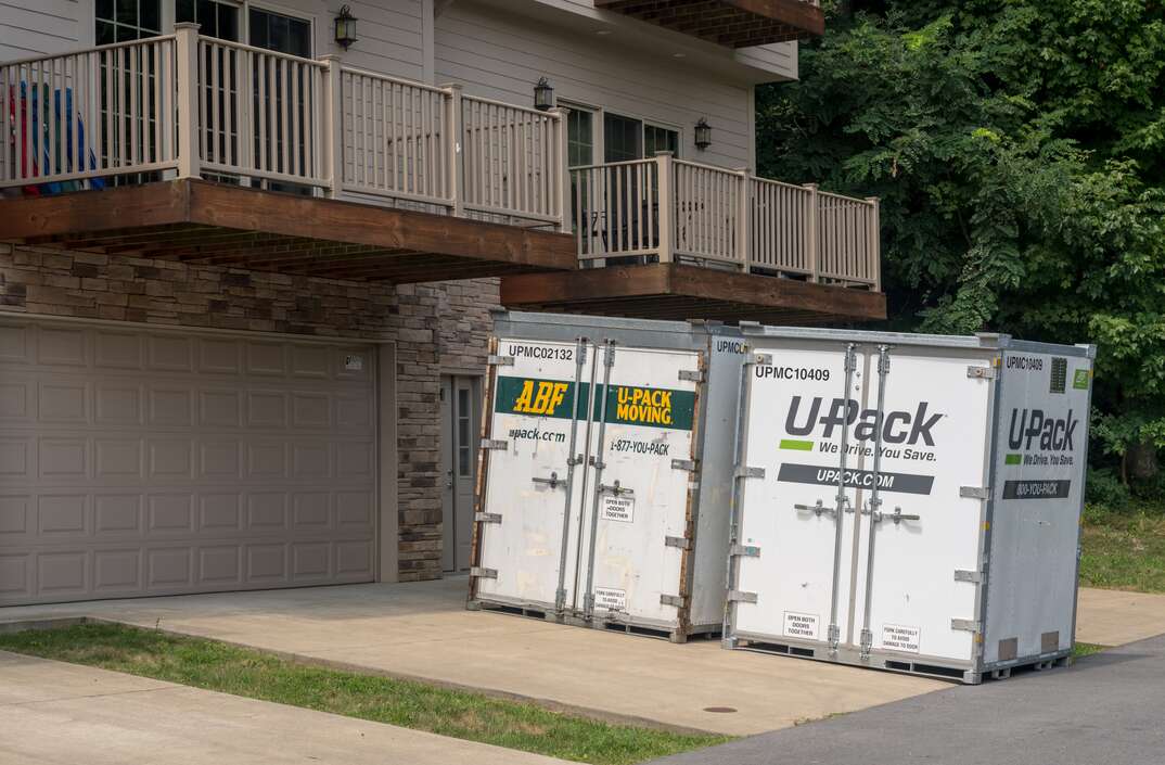 MORGANTOWN, WV - 12 AUGUST 2018: UPack Relocube moving containers on driveway of townhouse