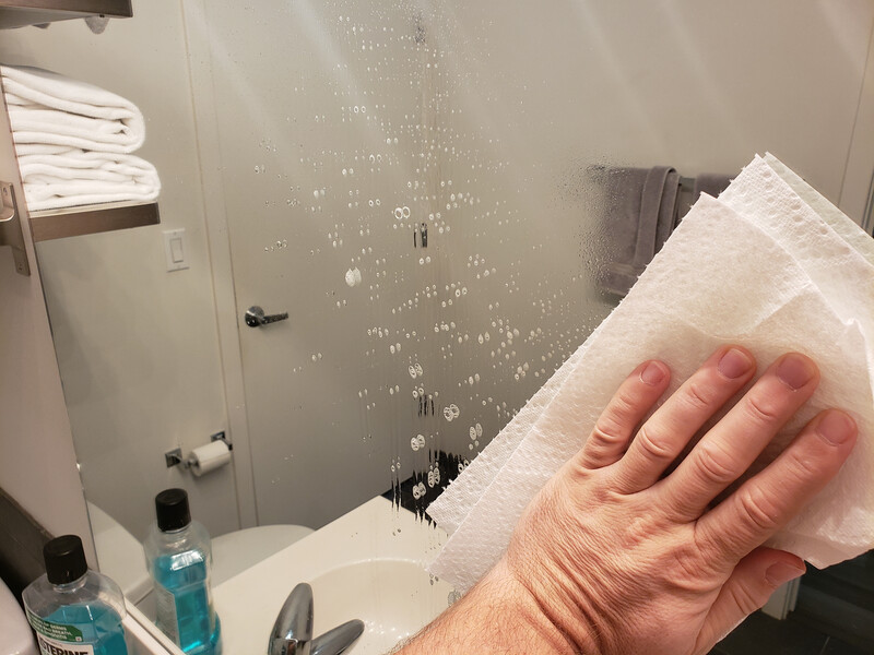 cleaning bathroom mirror