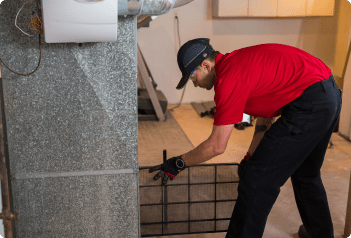 Technician working on an HVAC system