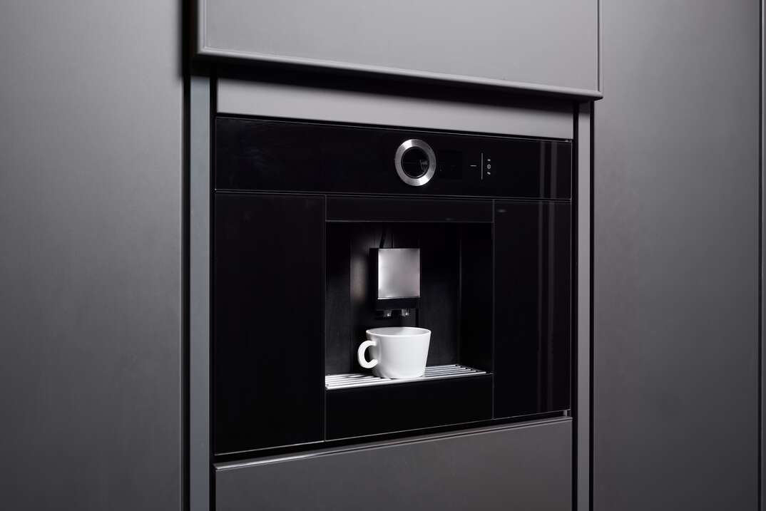 Built-in coffee machine in contemporary kitchen no people