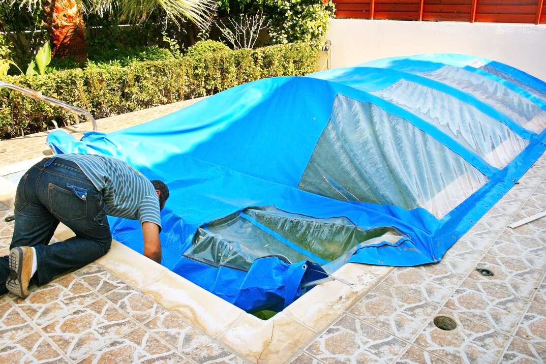 man fixing pool plumbing