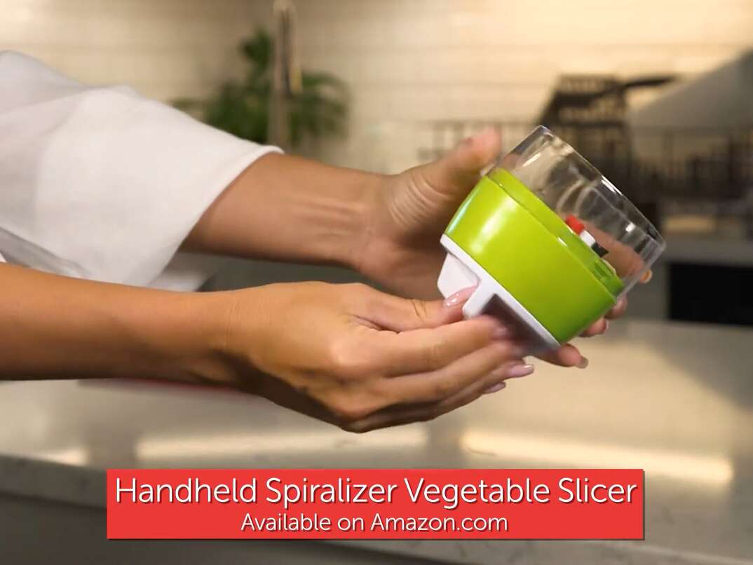 female hands holding and displaying a vegetable spiralizer