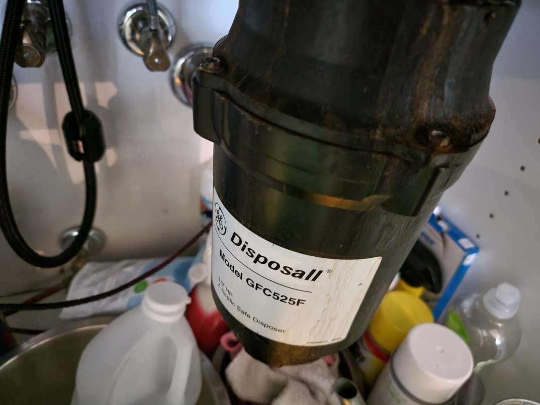 garbage disposal unit under kitchen sink