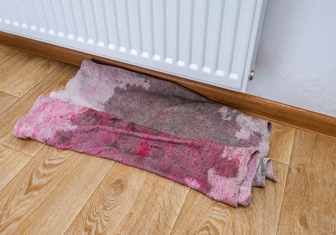 Leaking radiator heater flooded the hardwood floor of a residence  