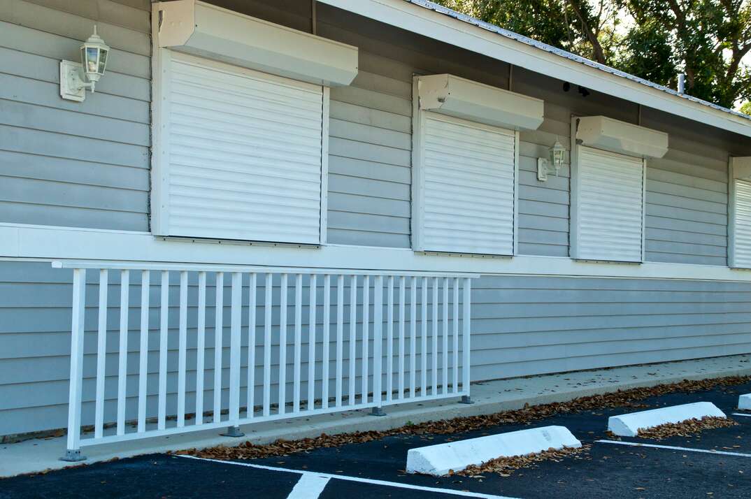 florida building with roll-up metal hurricane shutters