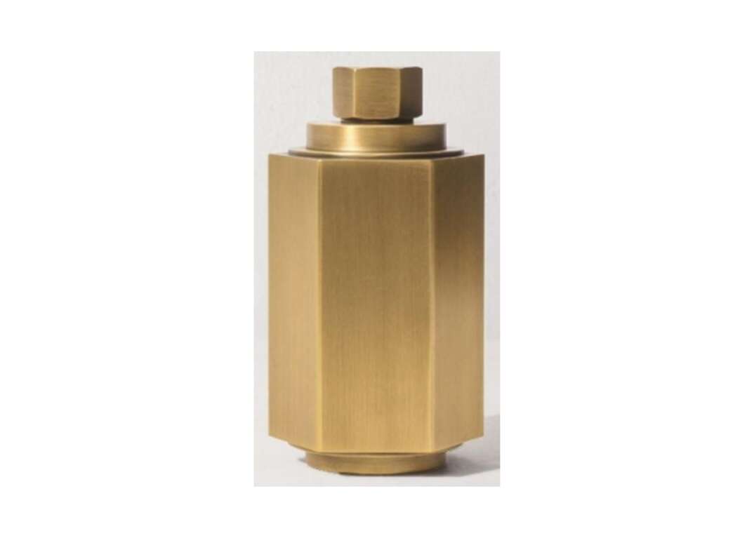 Gold metal hexagonal torch canister on a white background