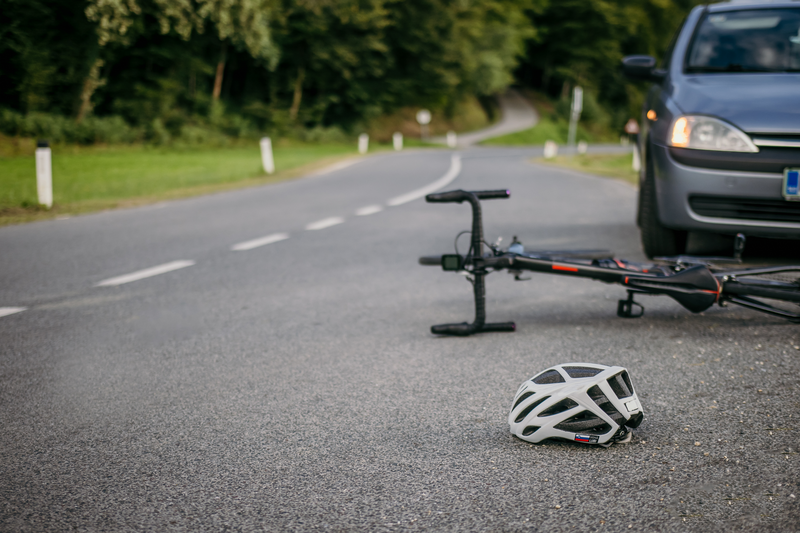 Cycling gear lying in front of the car hitting the cyclist.