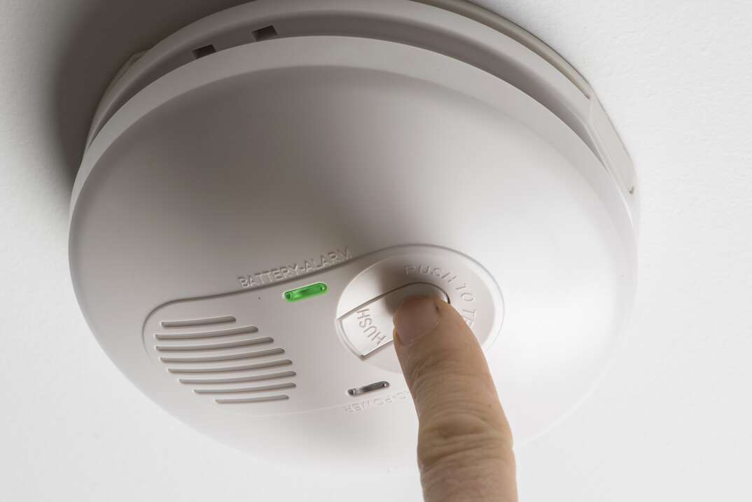 pushing the button on smoke detector