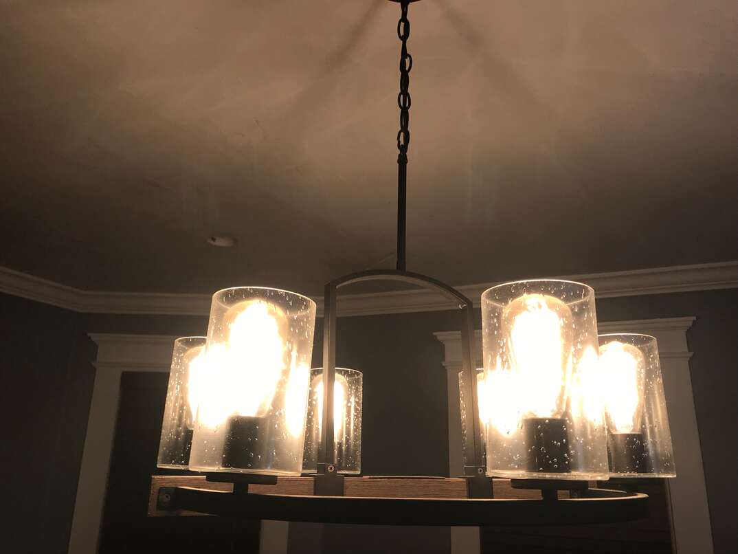 Dining room ceiling after paint with chandelier