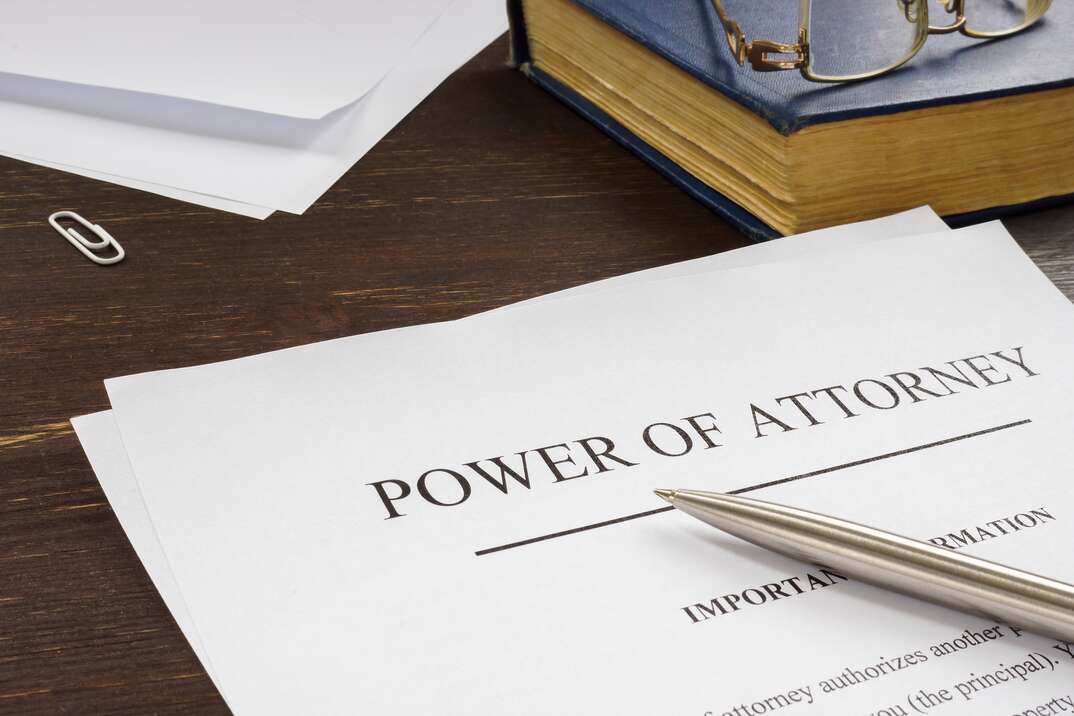 Power of attorney POA legal document and pen.