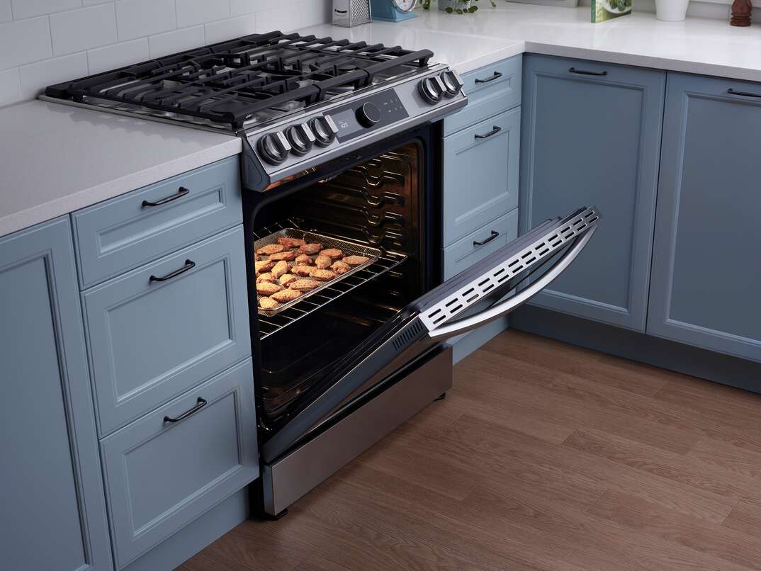 open Samsung oven with cookies baking inside