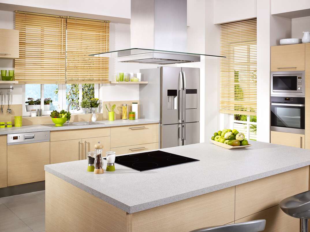Modern domestic kitchen with island range and range hood