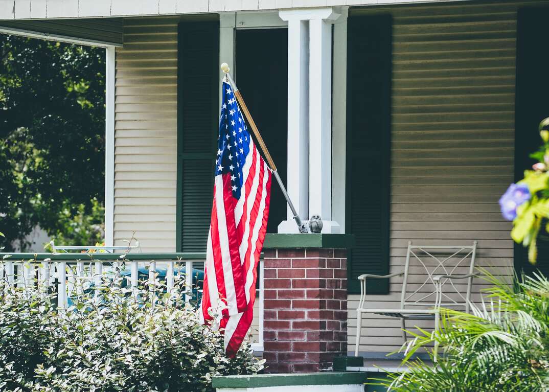 American flag mounted on house