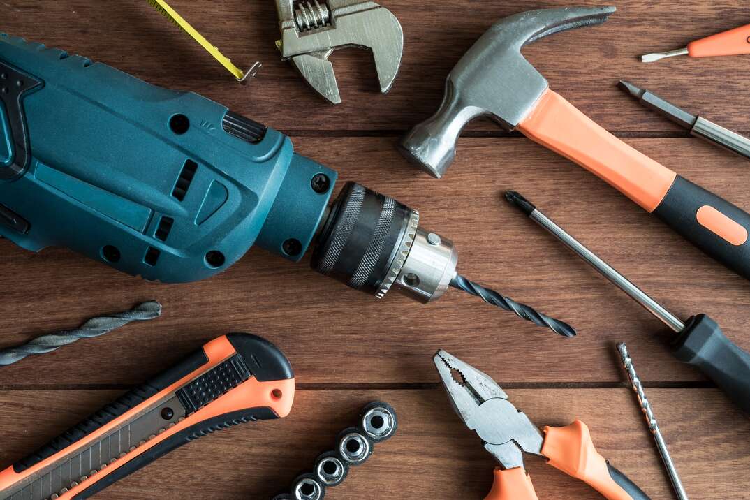 Set of work tools on wooden background, Top view