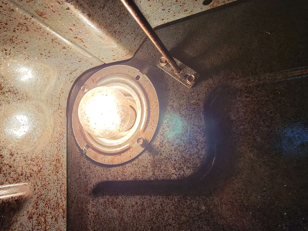 interior of an oven with lightbulb