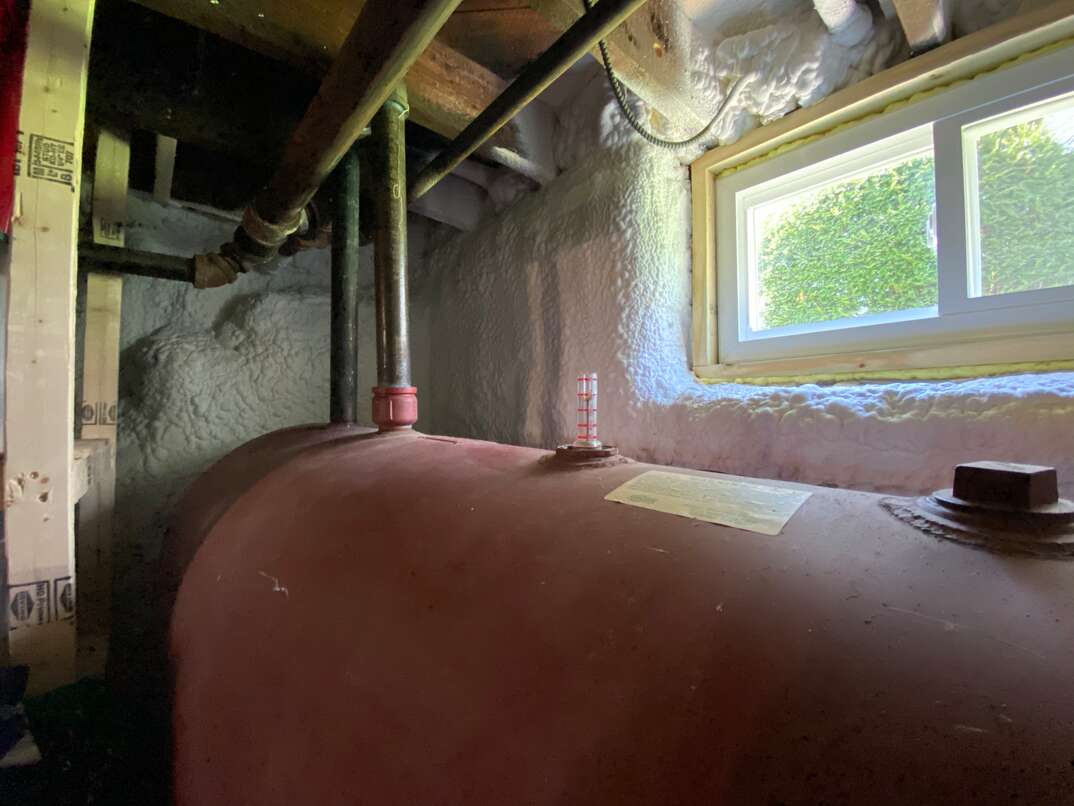 Oil heater tank in basement