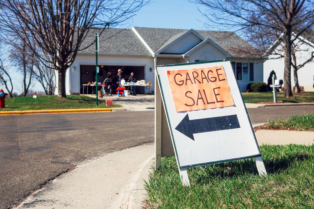 garage sale sign on a street corner