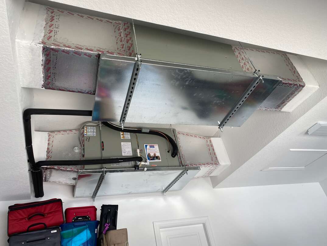 a new ceiling mounted air handler hangs in a new Florida home