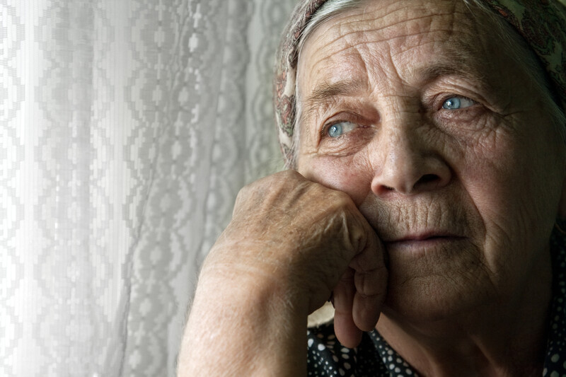 Portrait of sad lonely pensive old senior woman