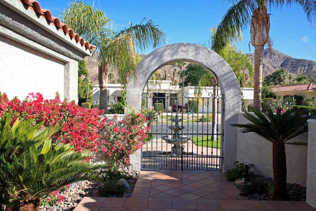 Inside Luxurious Xeriscaped Courtyard Looking To Street