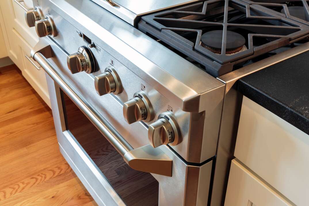 front and knobs of a stainless steel oven