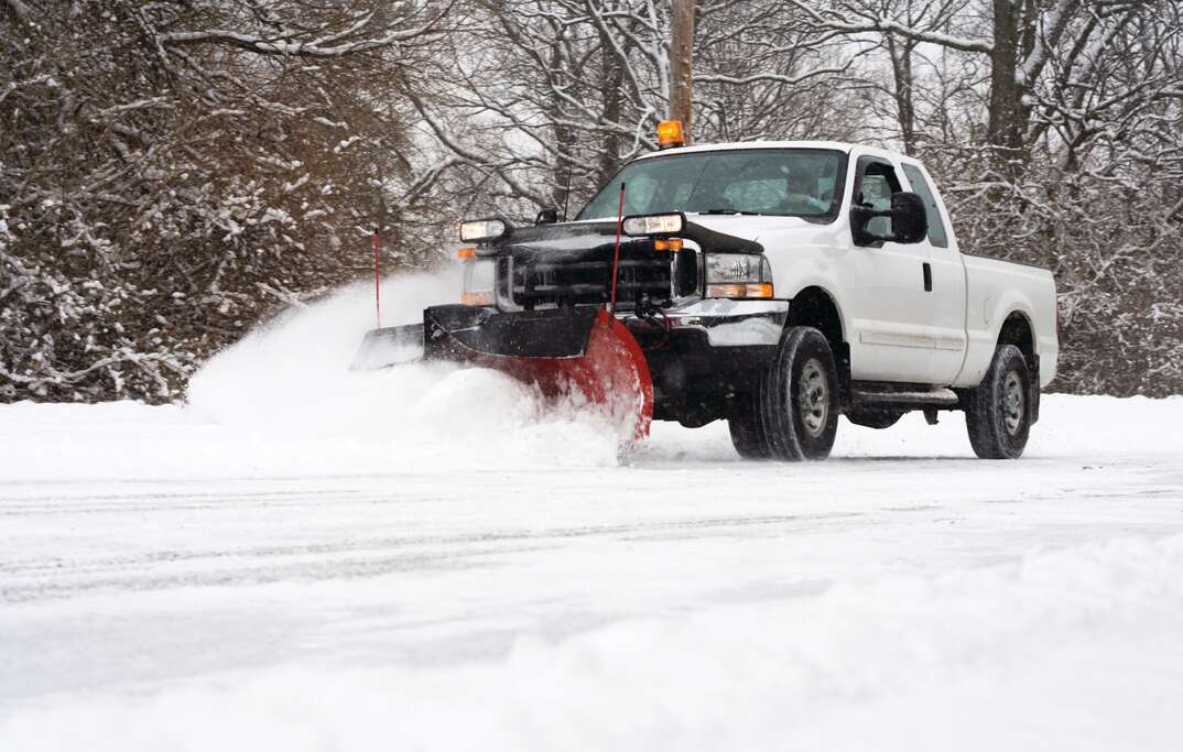 pickup truck plowing snow