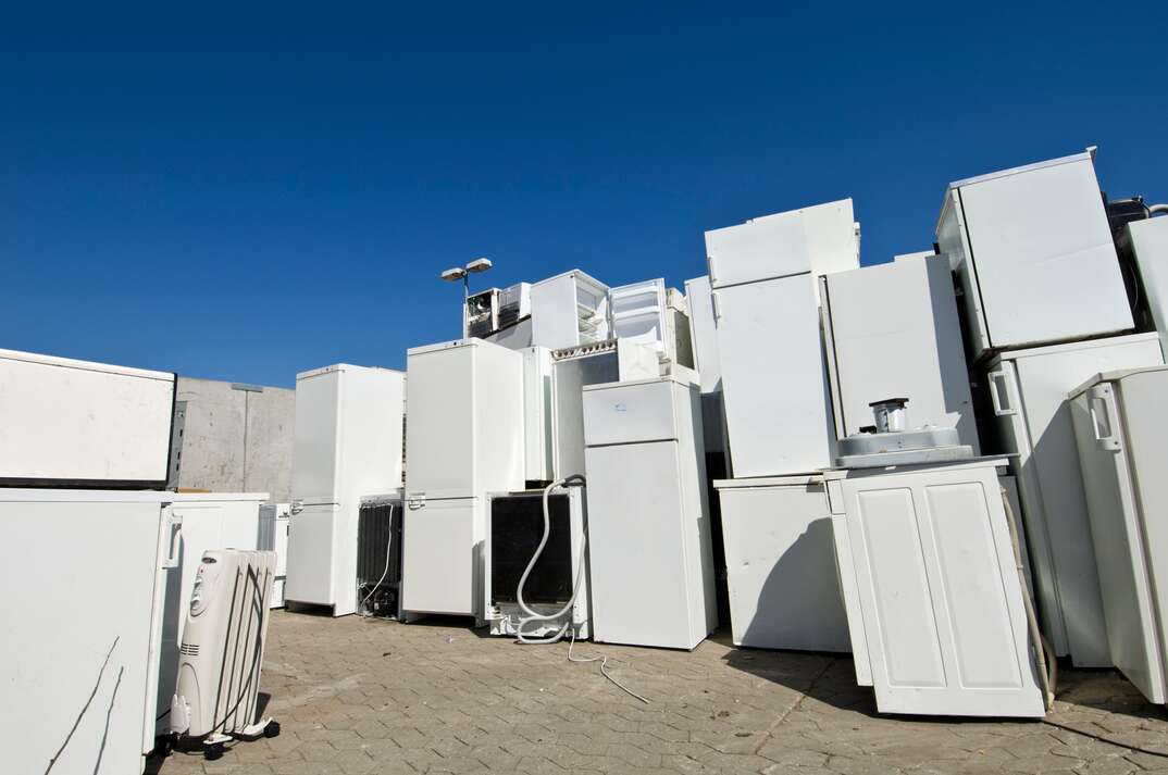 Old Refrigerators Waiting to Be  Scrapped At a Recycling Center