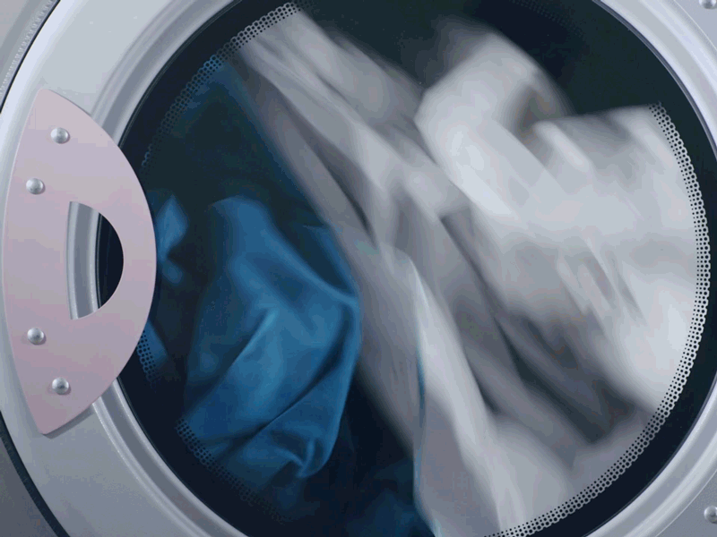 residential dryer cycles with clothes tumbling inside.