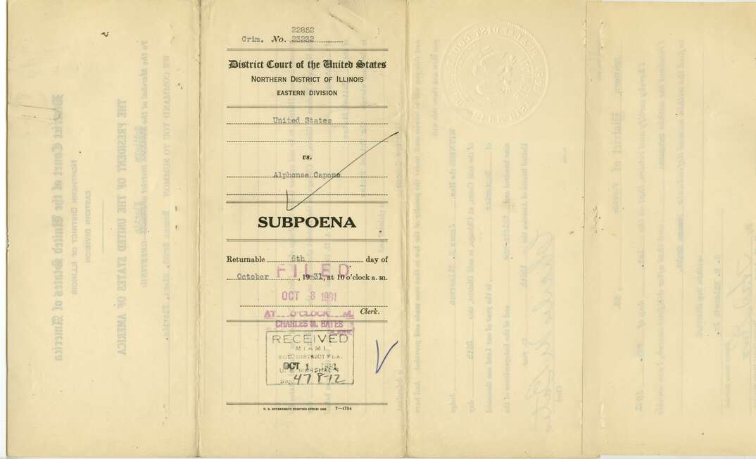 A yellowing legal document is marked as a subpoena for Alfonso Capone, Al Capone, Capone, yellow, document, paper, legal, legal document, subpoena, summons, court, criminal, crime, criminal investigation, lawsuit, legal issue, legal trouble