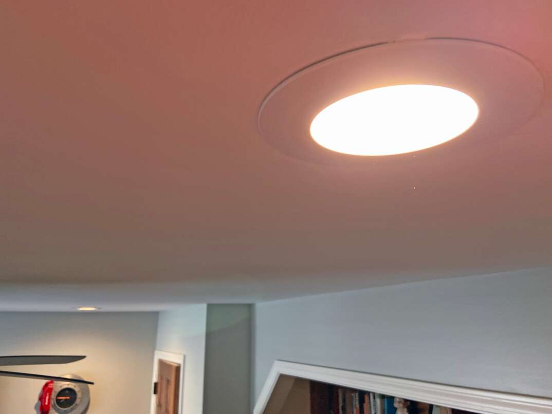 close up shot of a recessed LED light mounted into a bedroom ceiling