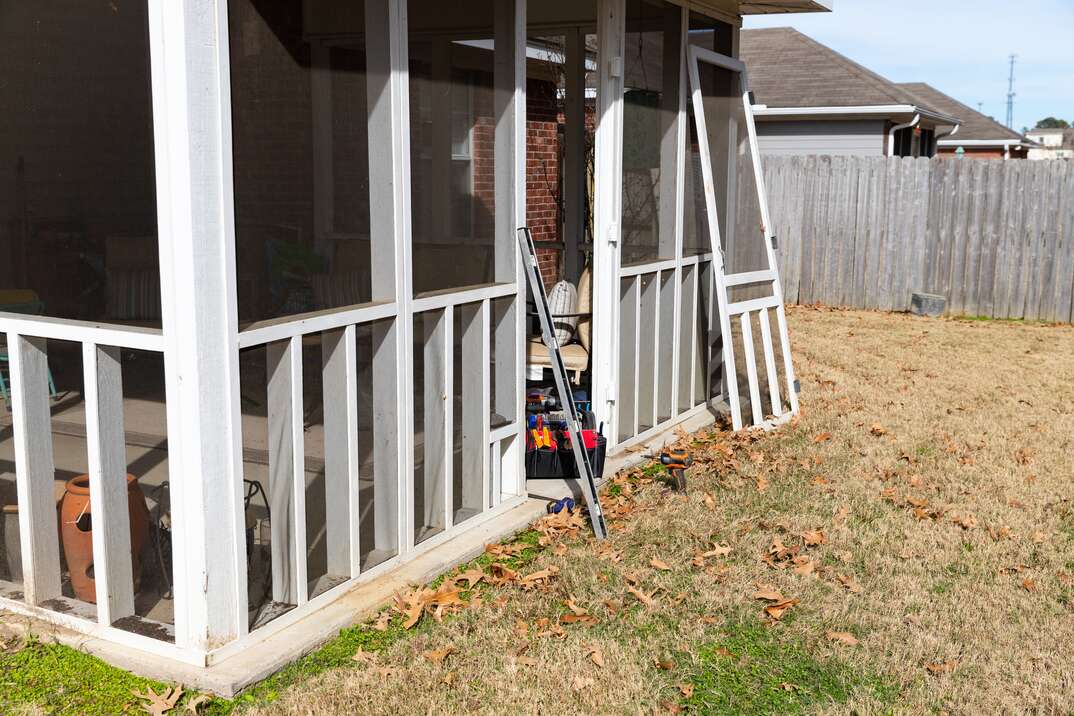 photo of a screened in porch being built 