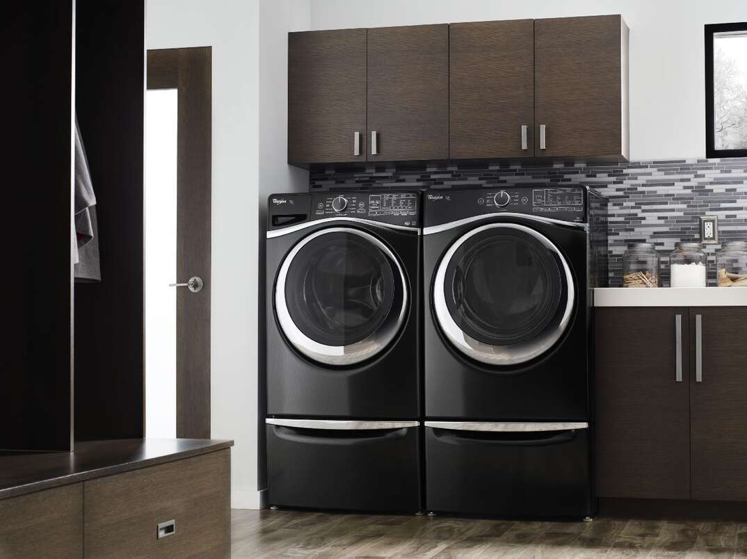 whirlpool washer and dryer in a laundry room