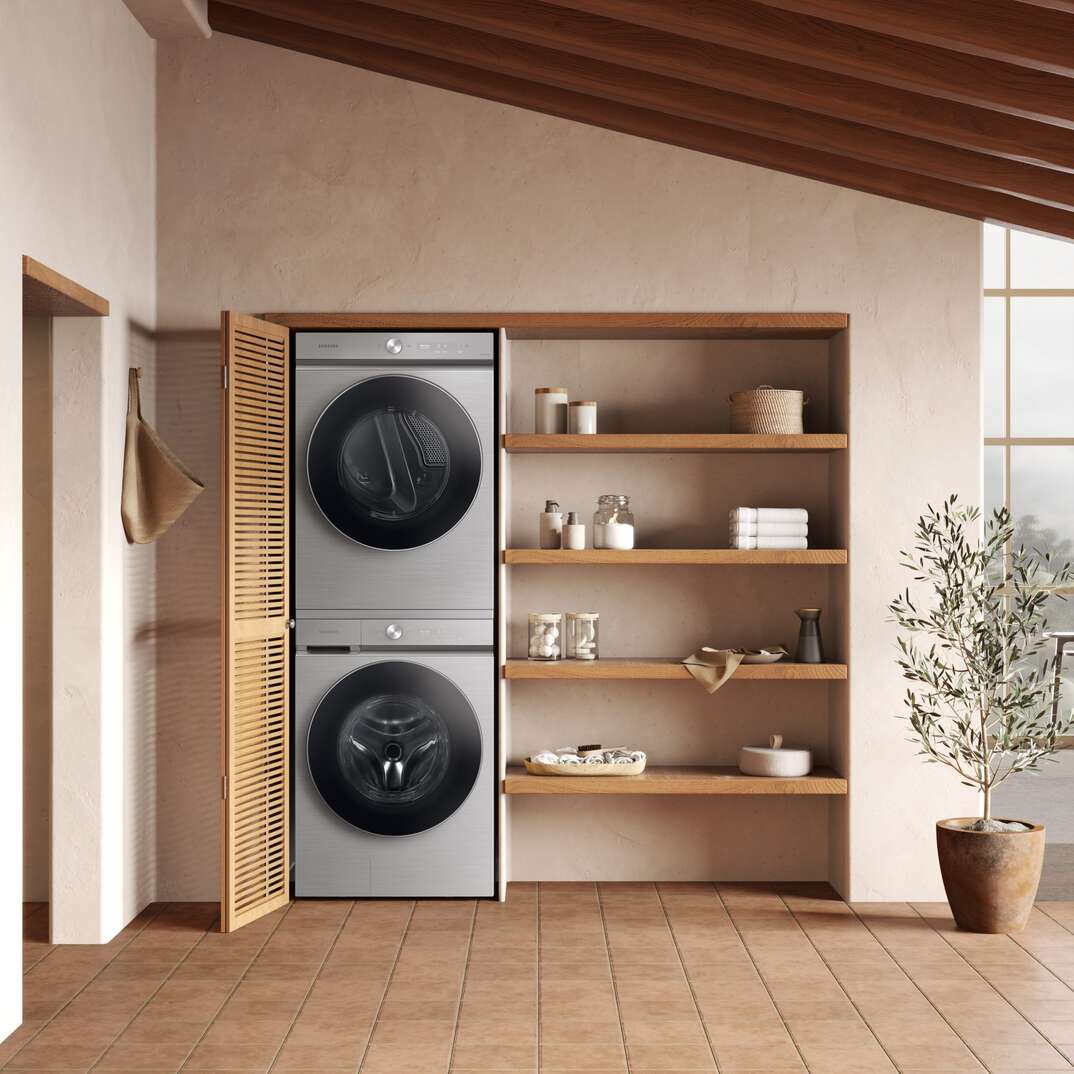 laundry room with stacked washer and dryer