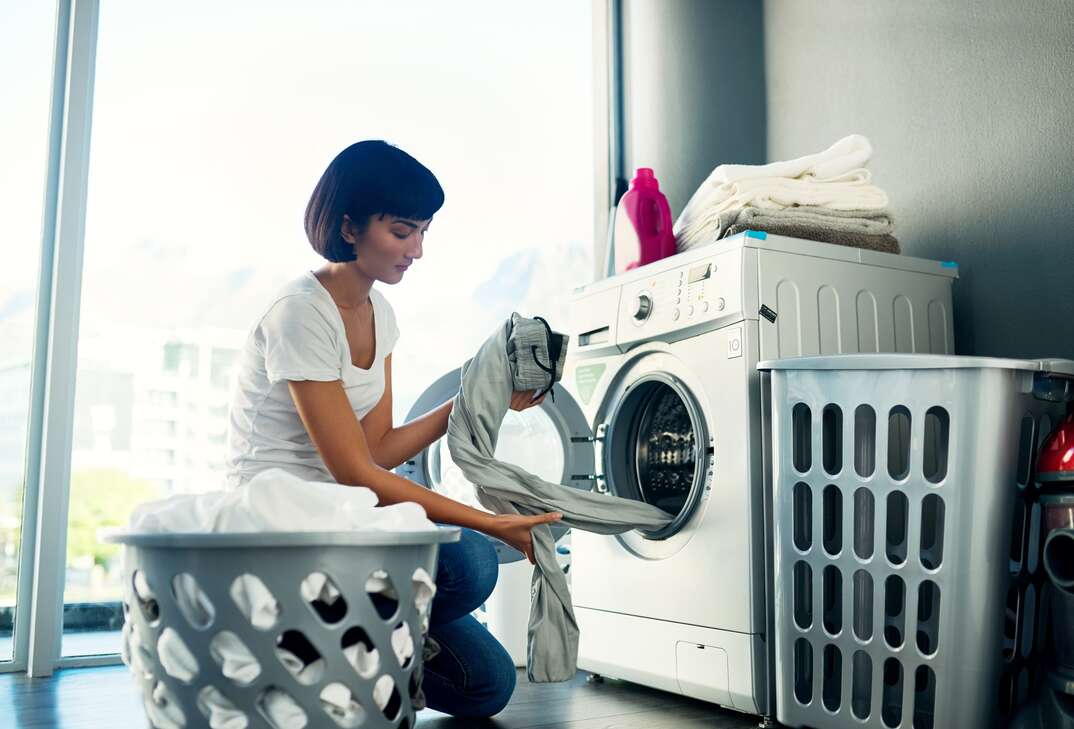 woman switching laundry
