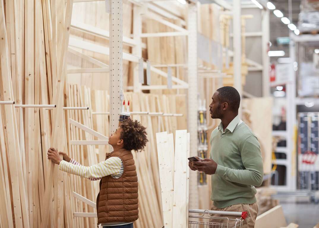 Dad and son shopping for lumber