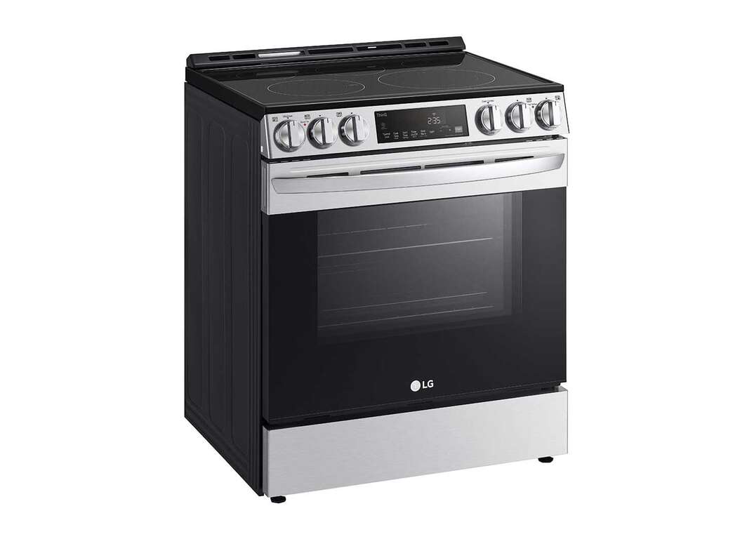 A stainless steel LG smart range with a black oven door and a black stovetop sits against a white background