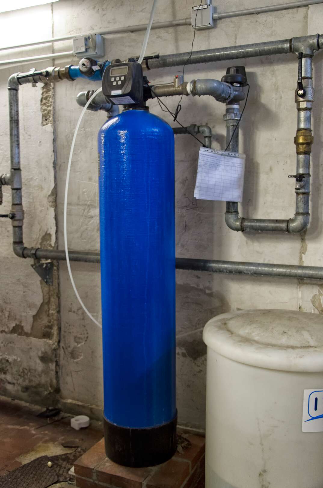 a large blue residential water softener